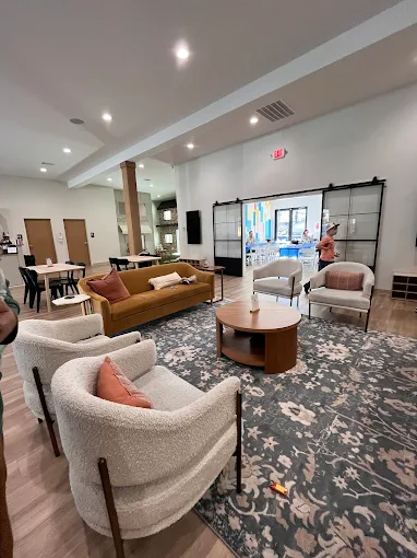 Inside Hey, Let's Play — a bright, open lounge with comfortable seating set up for creating together
